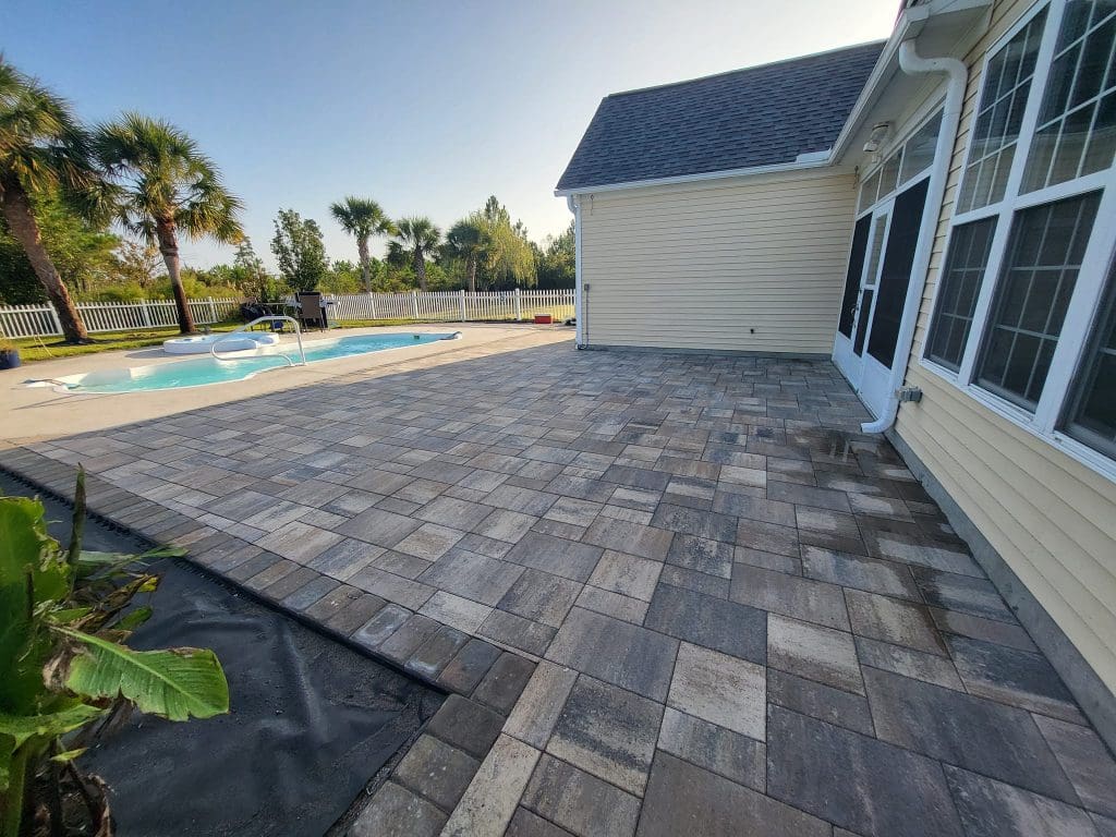 Belgard multi-colored pavers for a patio with a pool
