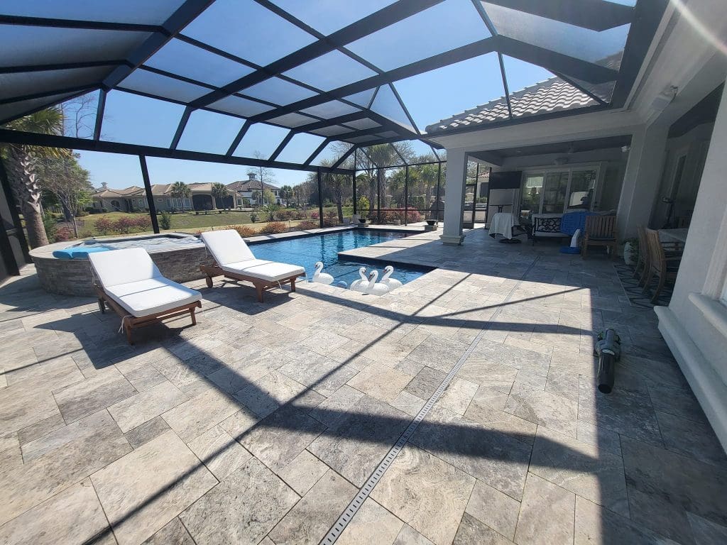 Belgard stone tile pavers around an in ground swimming pool