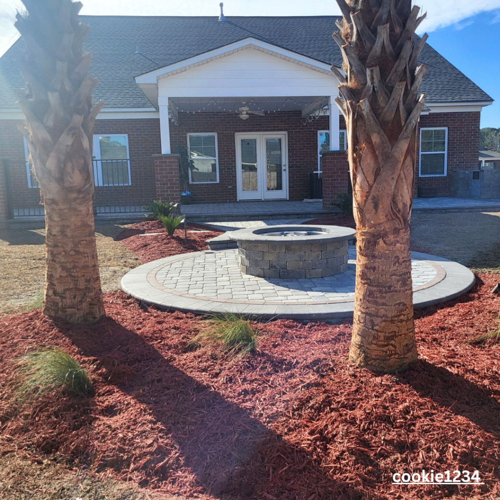 red mulch with palm trees by Elite Coastal landscaping myrtle beach