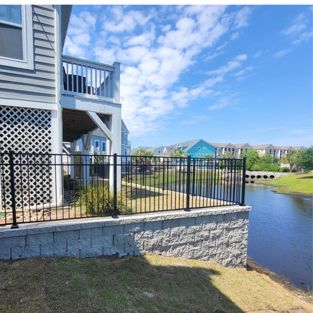 retaining wall in front of backyard lake in myrtle beach