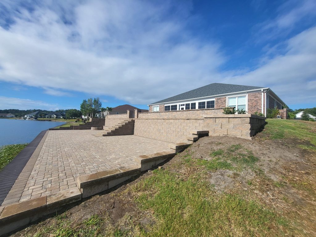 large retaining wall covering large sloped yard in myrtle beach